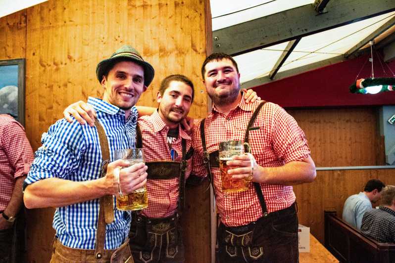 Munich: Oktoberfest Tour with Tent Reservation, Food & Beer - The guided grounds walk: photo stops, sideshows, and the story behind the Wiesn
